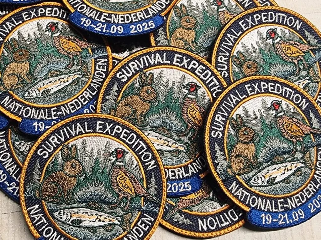 Naszywki haftowane z rzepem dla Nationale-Nederlanden związane z Survival Expedition 2025